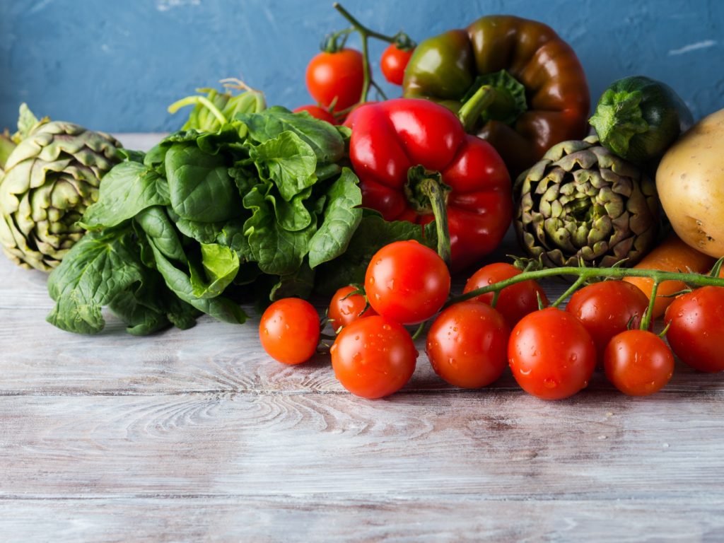 Assortment of fresh vegetables on table